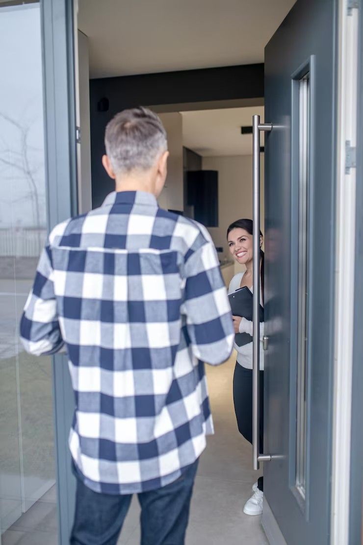 Technician installing deadbolt