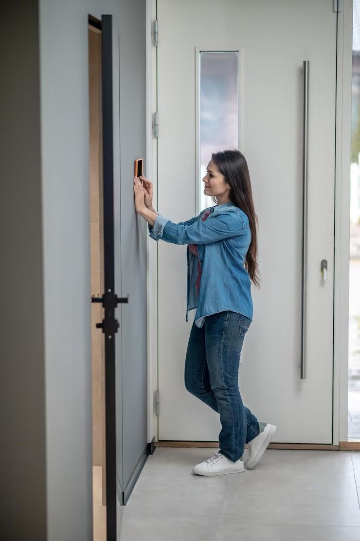 Locksmith installing access control panel